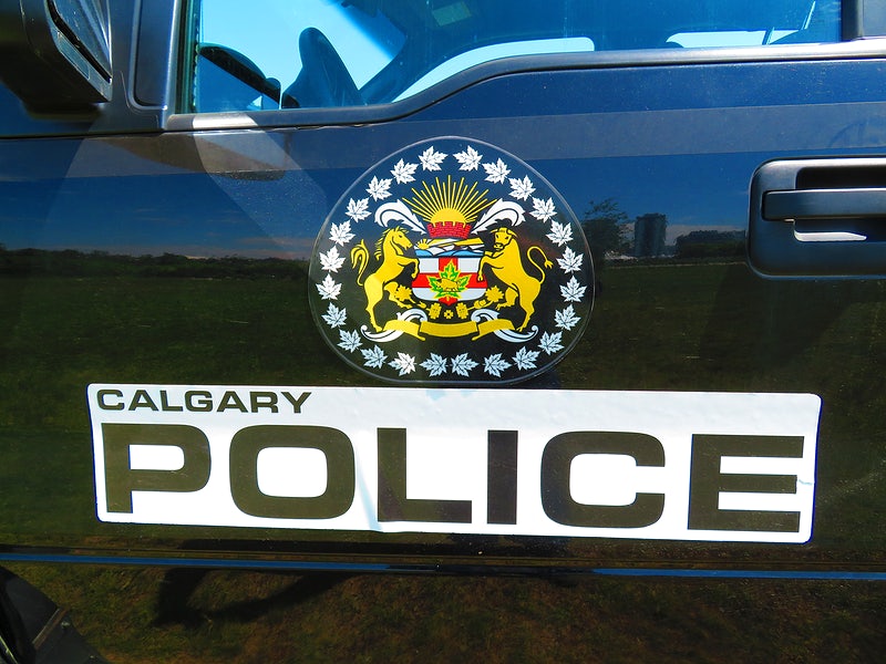 Calgary police emblem on police vehicle.