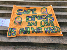 Safe drugs and love is all we need sign.