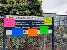 Status for all posters on migrant detention sign in Surrey.