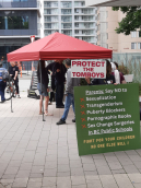 Far-right tent with transphobic placards